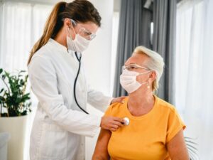 lady having her heart beat checked